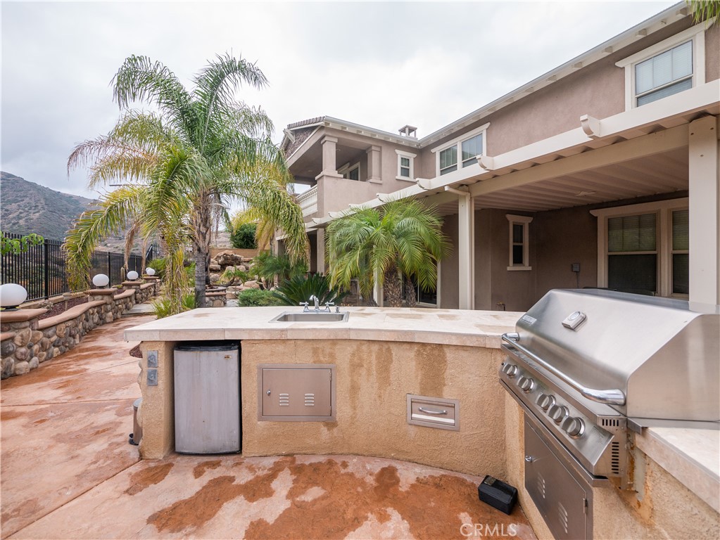 8111 Sunset Rose Drive Corona, CA 92883 - Photo 16 of 19 a view of a house with a iron gate