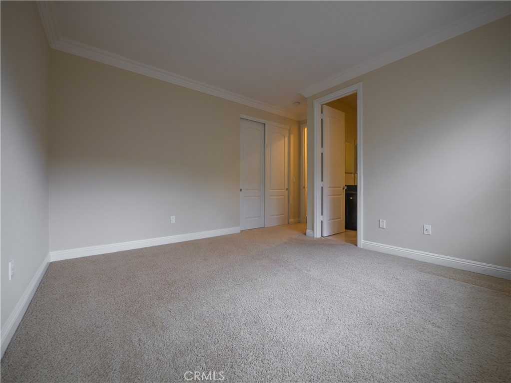 8111 Sunset Rose Drive Corona, CA 92883 - Photo 8 of 19 a view of an empty room and a window