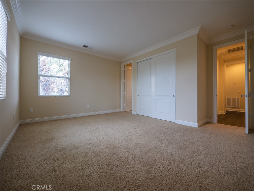 8111 Sunset Rose Drive Corona, CA 92883 - Photo 9 of 19 a view of an empty room with a window