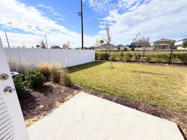 a view of a yard with an ocean view