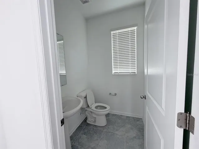 a bathroom with a toilet and a sink