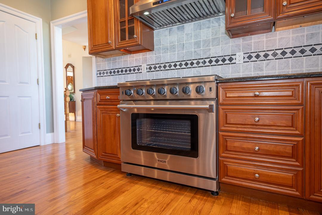 2 Spring Meadows Farm Lane Malvern, PA 19355 - Photo 12 of 63 a stove top oven sitting inside of a kitchen
