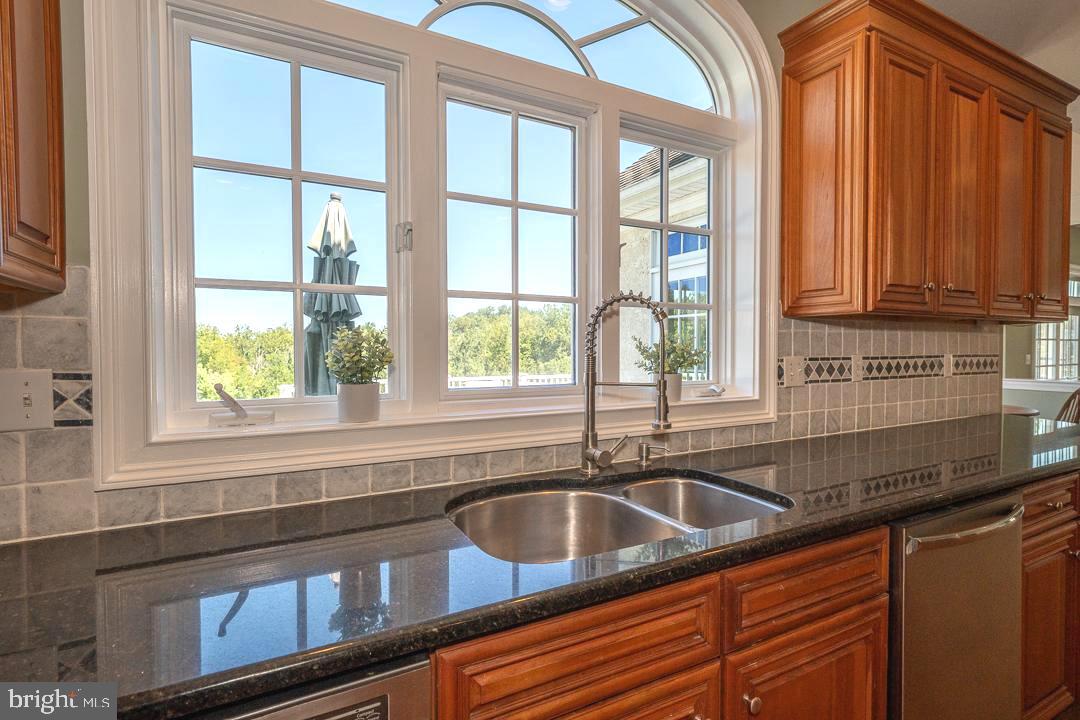 2 Spring Meadows Farm Lane Malvern, PA 19355 - Photo 15 of 63 a kitchen with stainless steel appliances a sink and a window