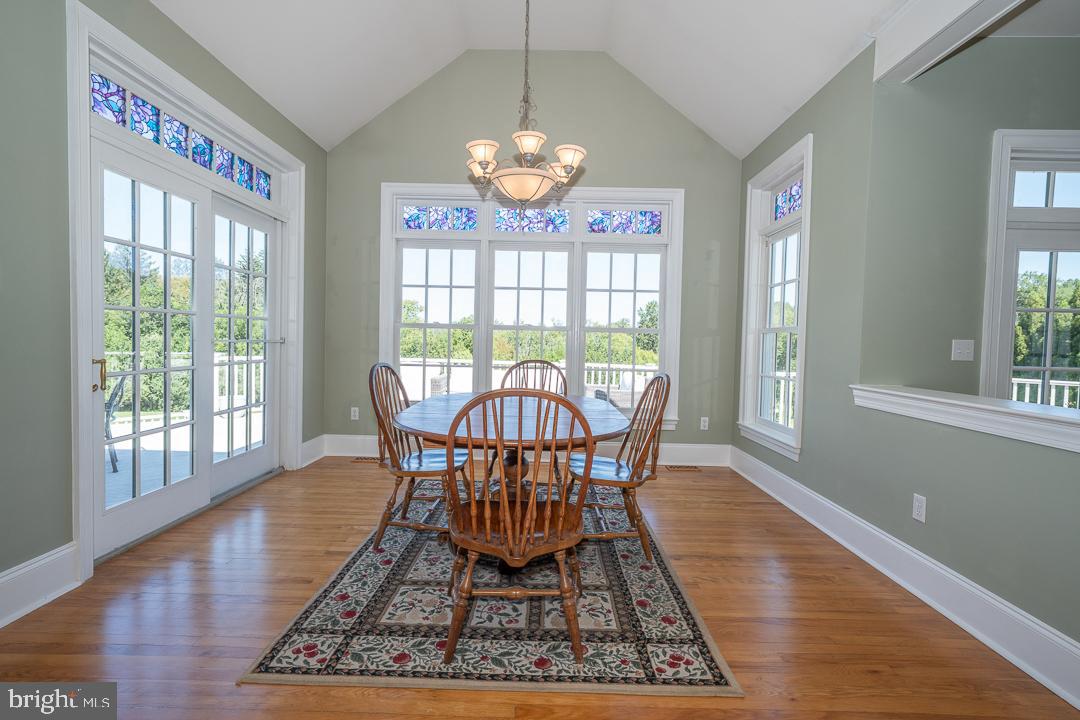2 Spring Meadows Farm Lane Malvern, PA 19355 - Photo 17 of 63 a view of a dining room with furniture a chandelier and wooden floor