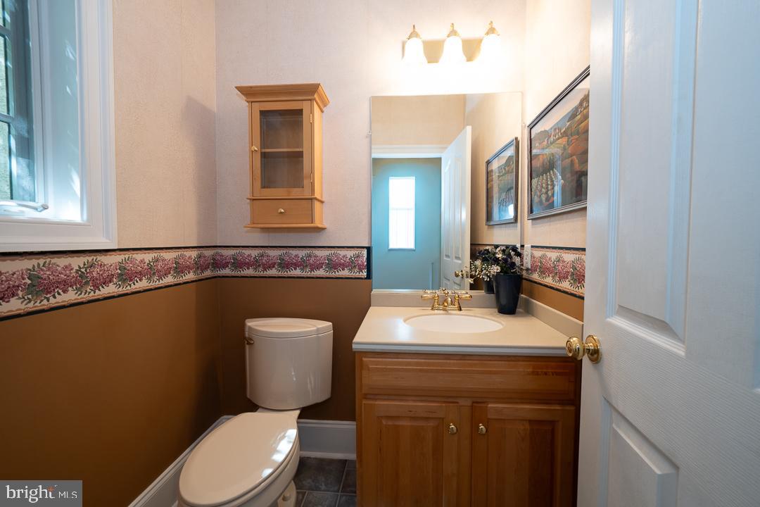2 Spring Meadows Farm Lane Malvern, PA 19355 - Photo 26 of 63 a bathroom with a toilet a sink and mirror