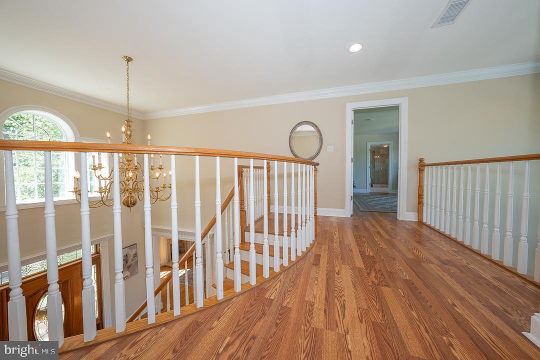 2 Spring Meadows Farm Lane Malvern, PA 19355 - Photo 27 of 63 a view of a hallway with wooden floor and windows