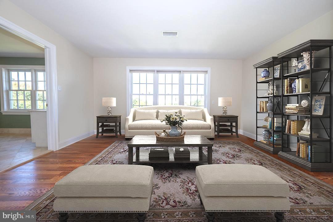 2 Spring Meadows Farm Lane Malvern, PA 19355 - Photo 30 of 63 a living room with furniture and a book shelf