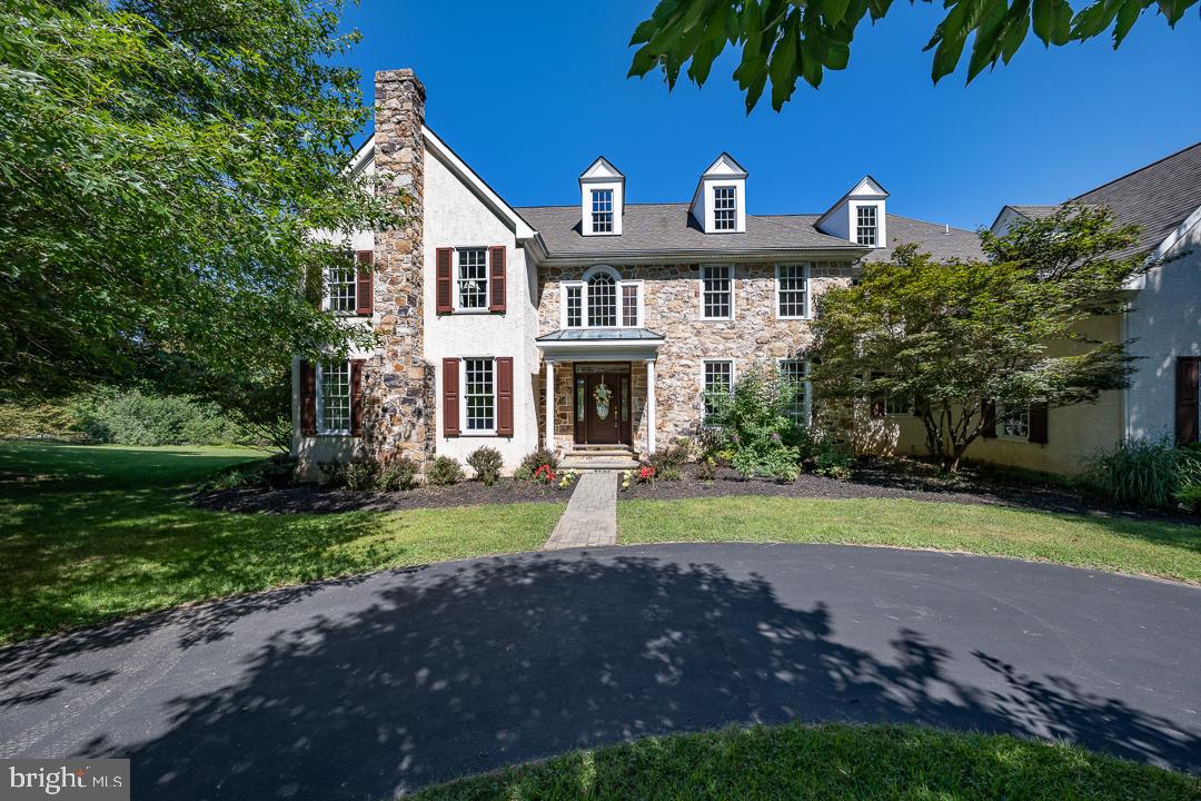2 Spring Meadows Farm Lane Malvern, PA 19355 - Photo 3 of 63 a front view of a house with a yard and garage