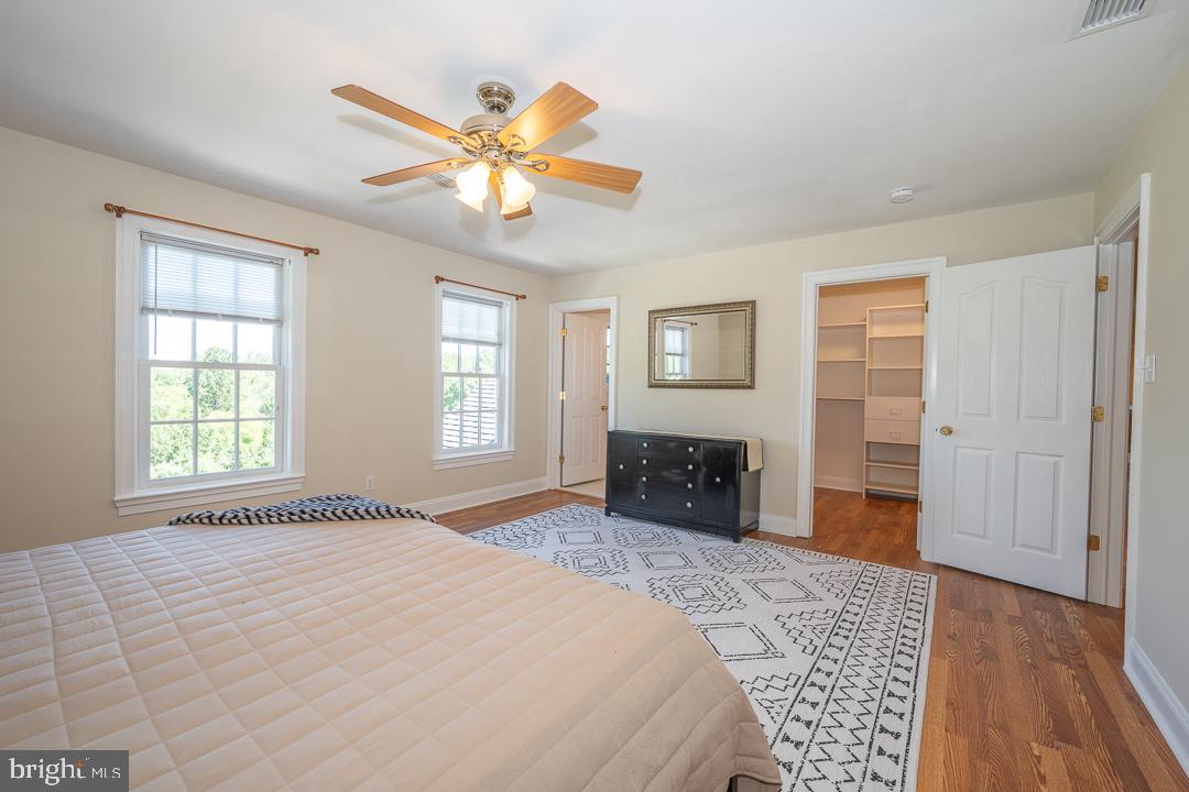 2 Spring Meadows Farm Lane Malvern, PA 19355 - Photo 37 of 63 a bedroom with a bed and a chandelier