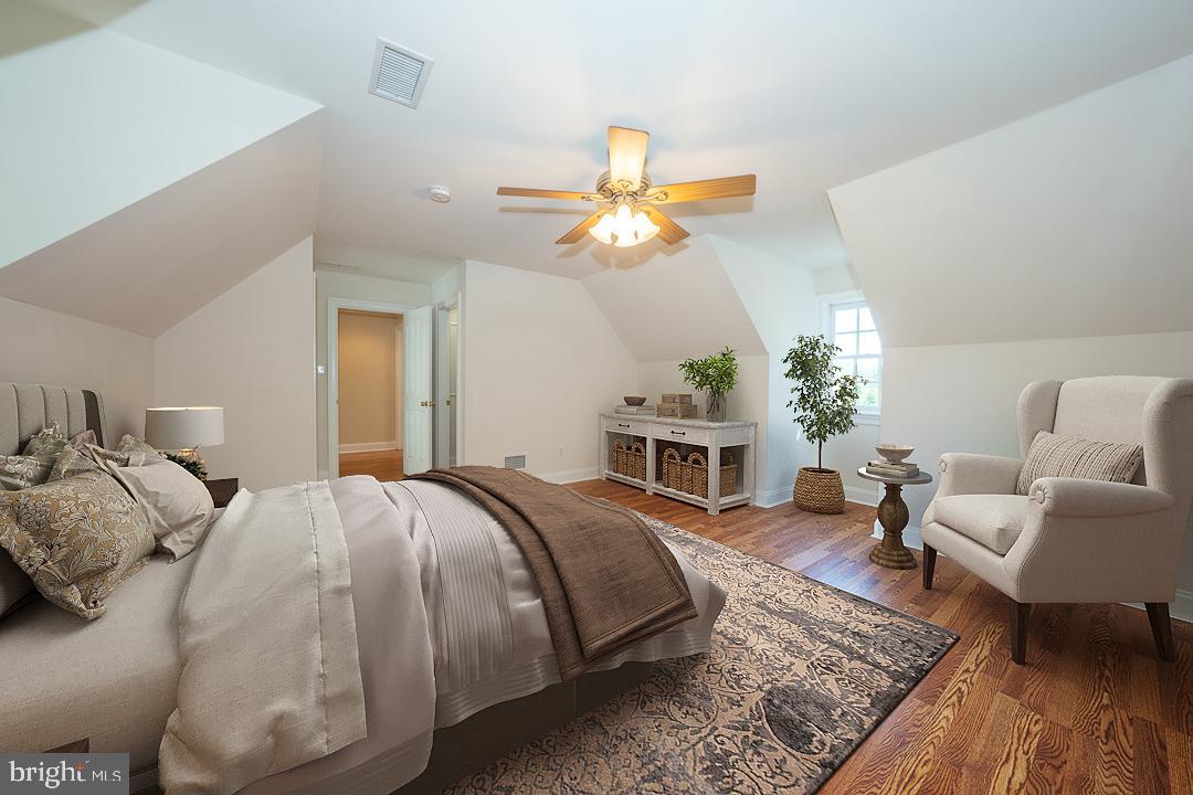 2 Spring Meadows Farm Lane Malvern, PA 19355 - Photo 43 of 63 a spacious bedroom with a bed a chandelier and a couch