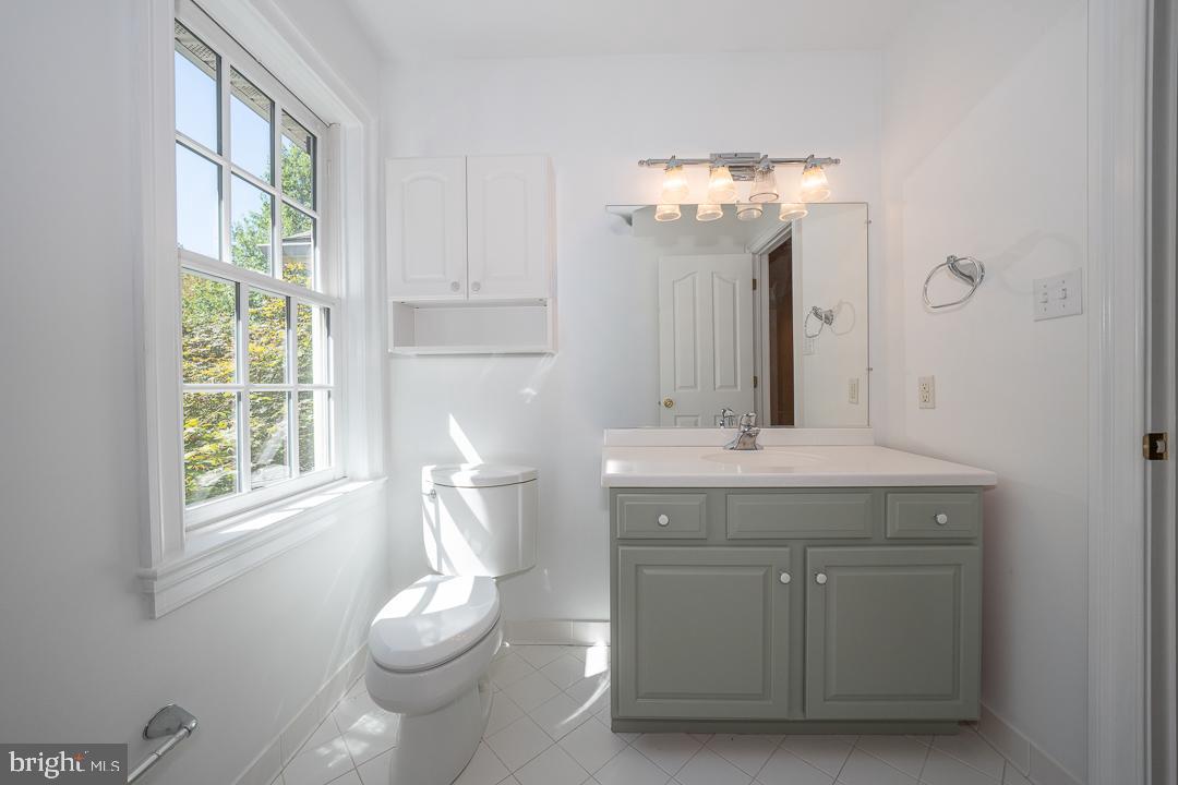 2 Spring Meadows Farm Lane Malvern, PA 19355 - Photo 46 of 63 a bathroom with a granite countertop sink a toilet and a mirror