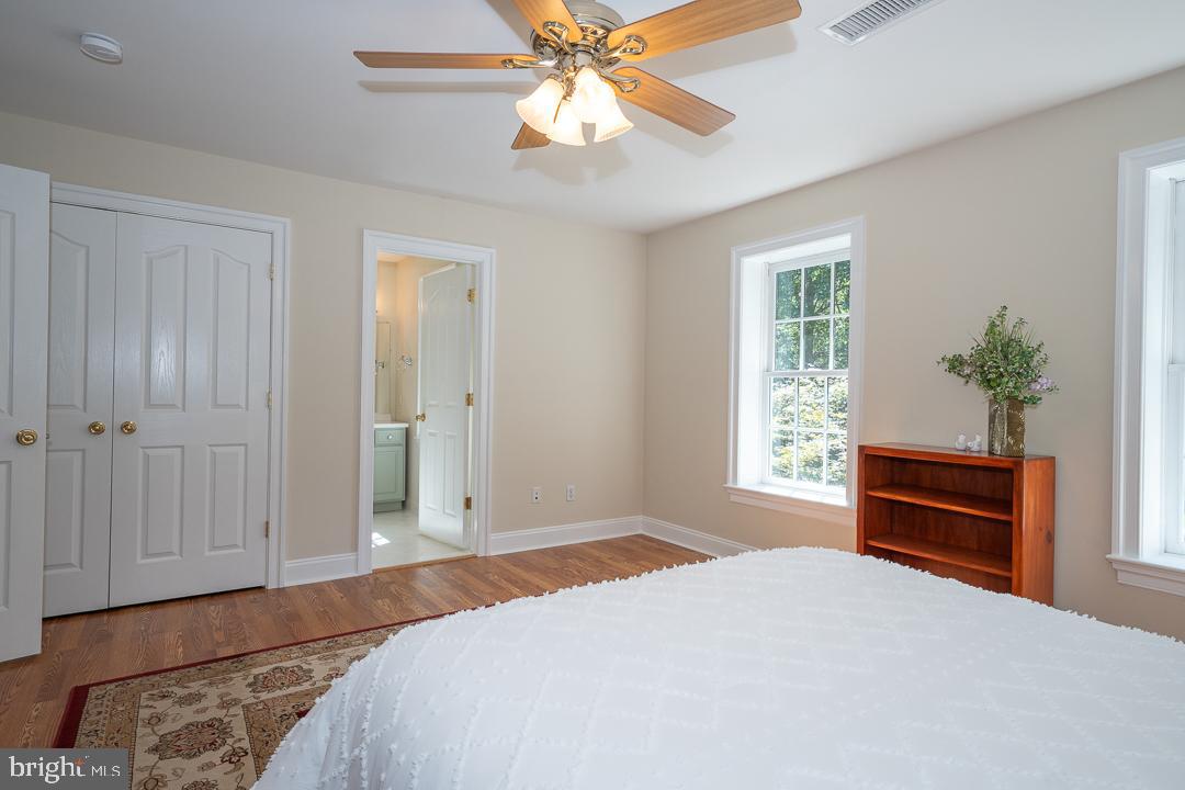 2 Spring Meadows Farm Lane Malvern, PA 19355 - Photo 48 of 63 a bedroom with a bed and a potted plant