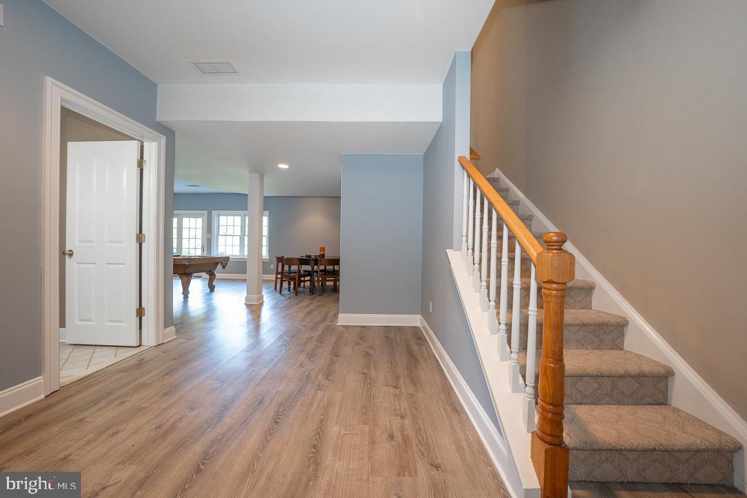 2 Spring Meadows Farm Lane Malvern, PA 19355 - Photo 50 of 63 a view of a hallway with wooden floor and furniture