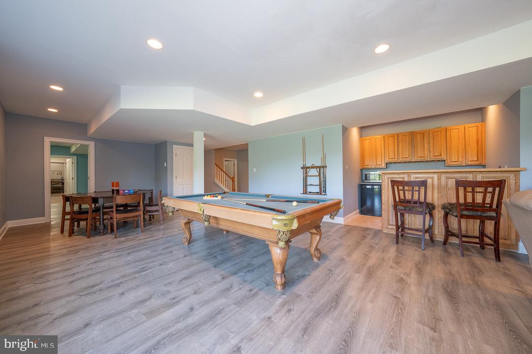 2 Spring Meadows Farm Lane Malvern, PA 19355 - Photo 51 of 63 a living room with furniture a dining table and a wooden floor