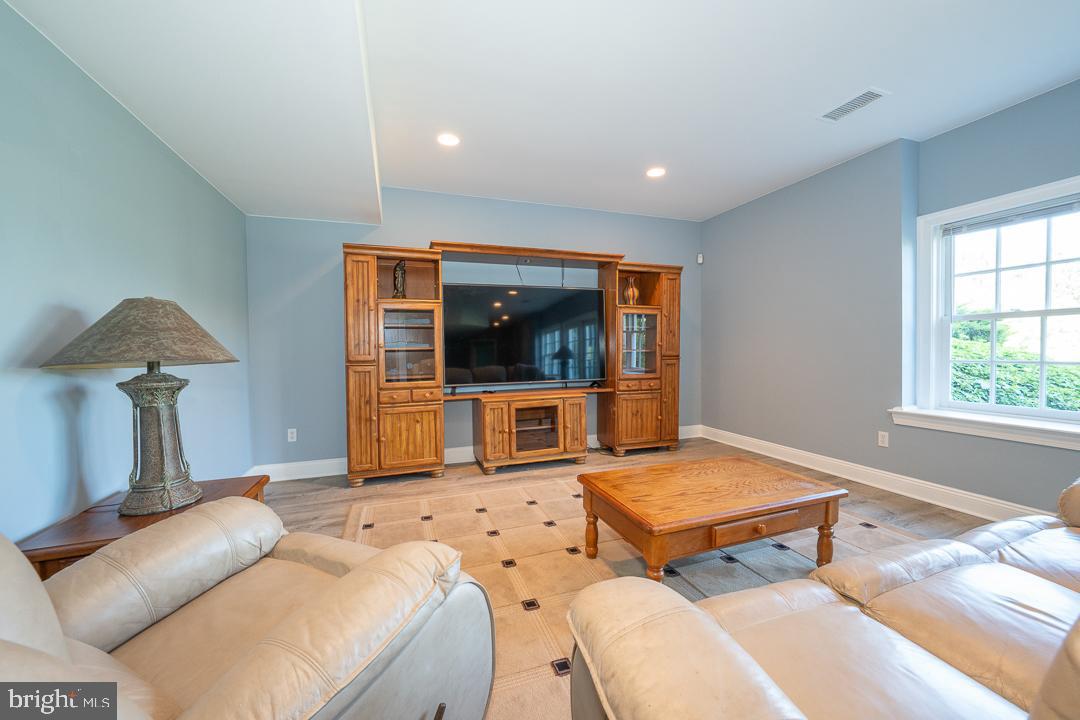 2 Spring Meadows Farm Lane Malvern, PA 19355 - Photo 52 of 63 a living room with furniture and a flat screen tv
