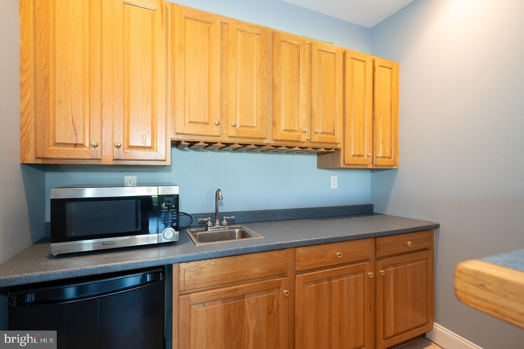 2 Spring Meadows Farm Lane Malvern, PA 19355 - Photo 54 of 63 a kitchen with stainless steel appliances granite countertop white cabinets and a microwave oven