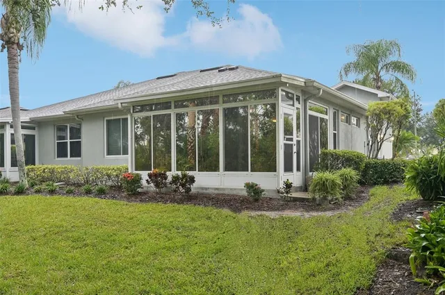 a front view of house with yard and outdoor seating