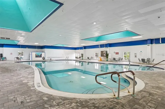 a view of a swimming pool with a terrace