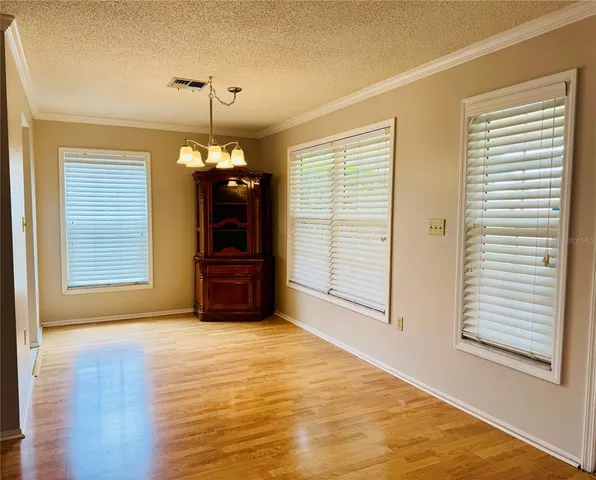 a big room with windows and closet