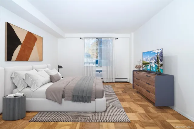 a living room with furniture and painting on the wall