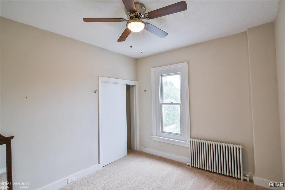 135 Howertown Road Catasauqua, PA 18032 - Photo 12 of 20 an empty room with windows and fan