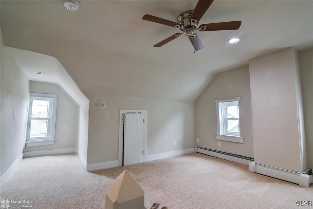 135 Howertown Road Catasauqua, PA 18032 - Photo 14 of 20 a view of a livingroom with a ceiling fan and window
