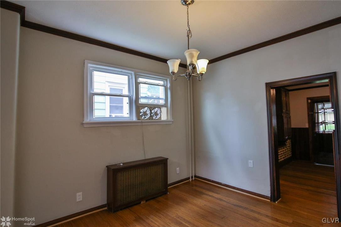 135 Howertown Road Catasauqua, PA 18032 - Photo 5 of 20 a view of an empty room with wooden floor and a window