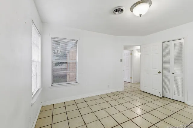 a view of a room that has a window in it