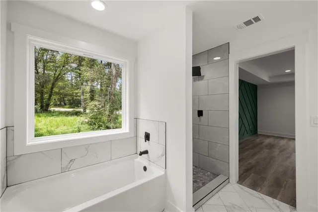 a view of a white house with a yard