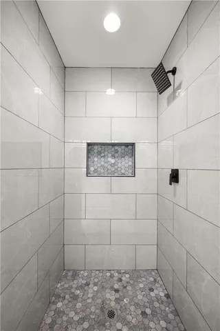 an aerial view of a house with a yard basket ball court and outdoor seating