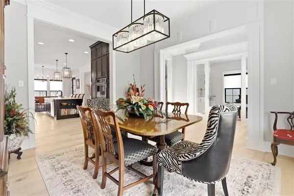 a kitchen with stainless steel appliances kitchen island granite countertop a refrigerator and a stove top oven