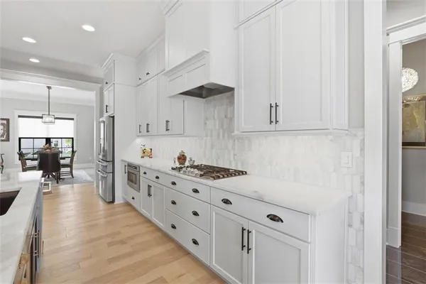 a kitchen with counter top space cabinets and appliances