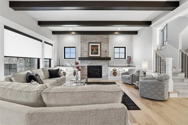 a living room with furniture and a rug
