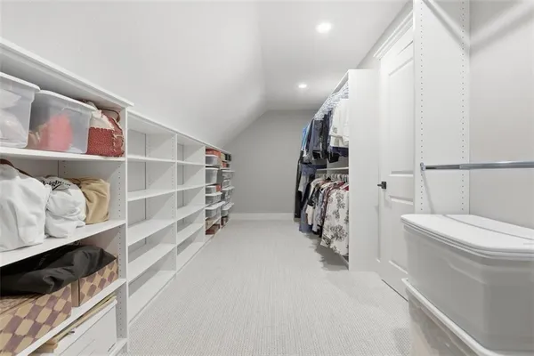 an empty room with furniture and natural light