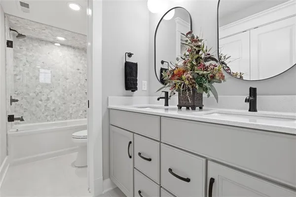 a bathroom with a toilet sink and bathtub