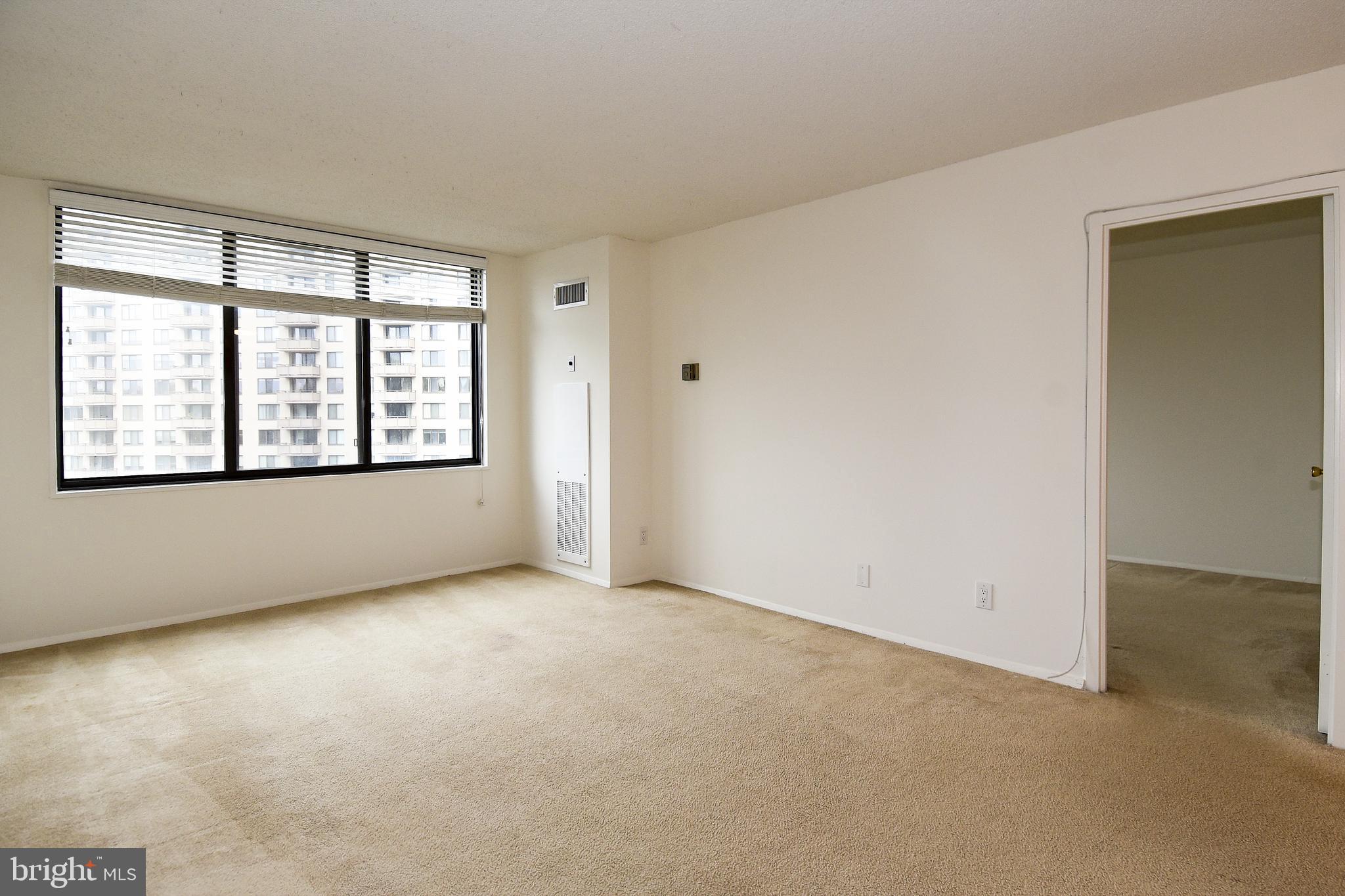 5225 Pooks Hill Road, Unit 1003S Bethesda, MD 20814 - Photo 2 of 30 an empty room with windows and closet