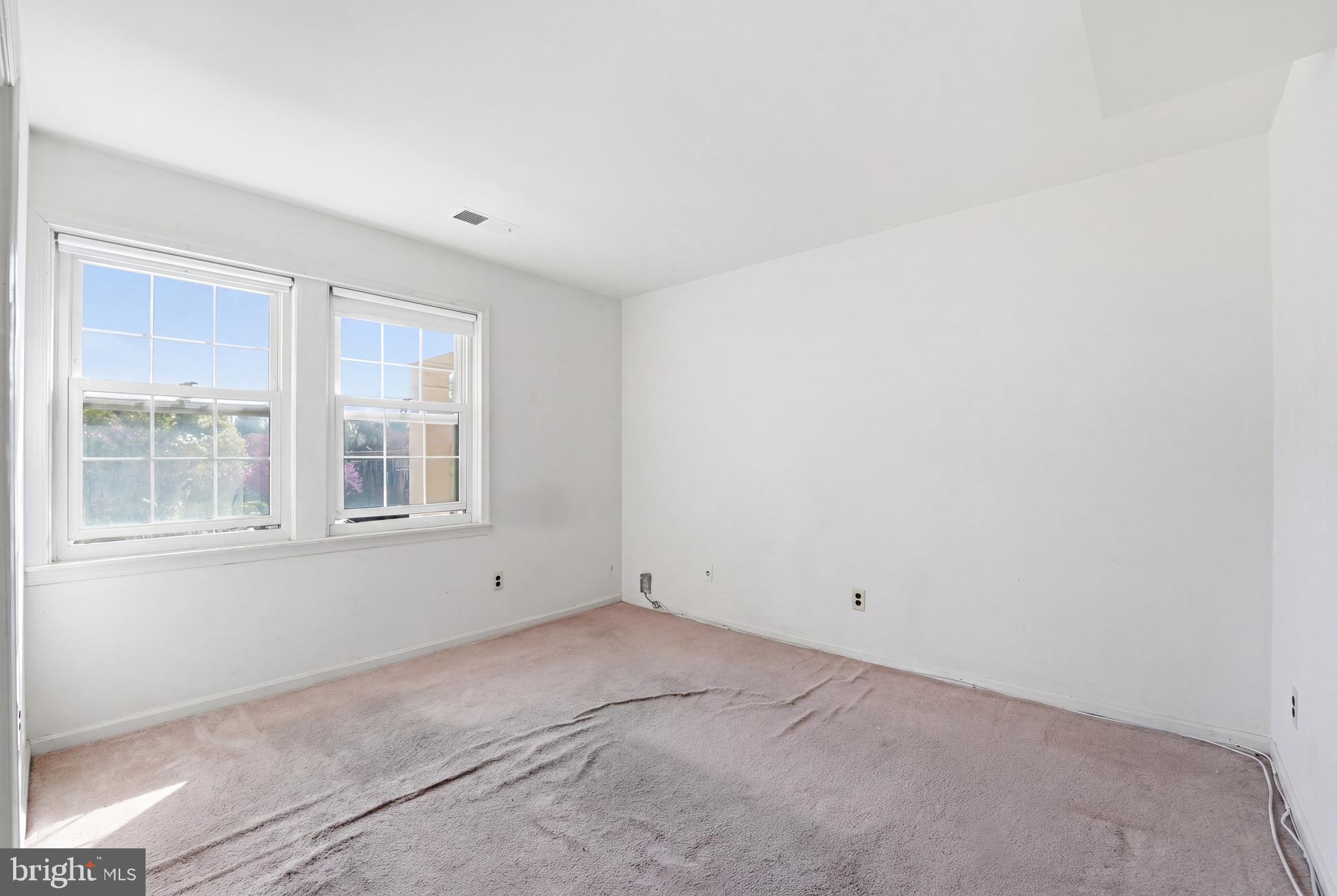 2011 37th Street Southeast, Unit 202 Washington, DC 20020 - Photo 11 of 24 an empty room with windows