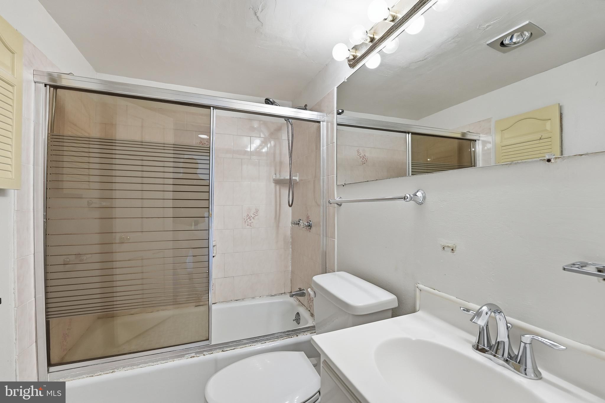 2011 37th Street Southeast, Unit 202 Washington, DC 20020 - Photo 15 of 24 a bathroom with a sink toilet and shower