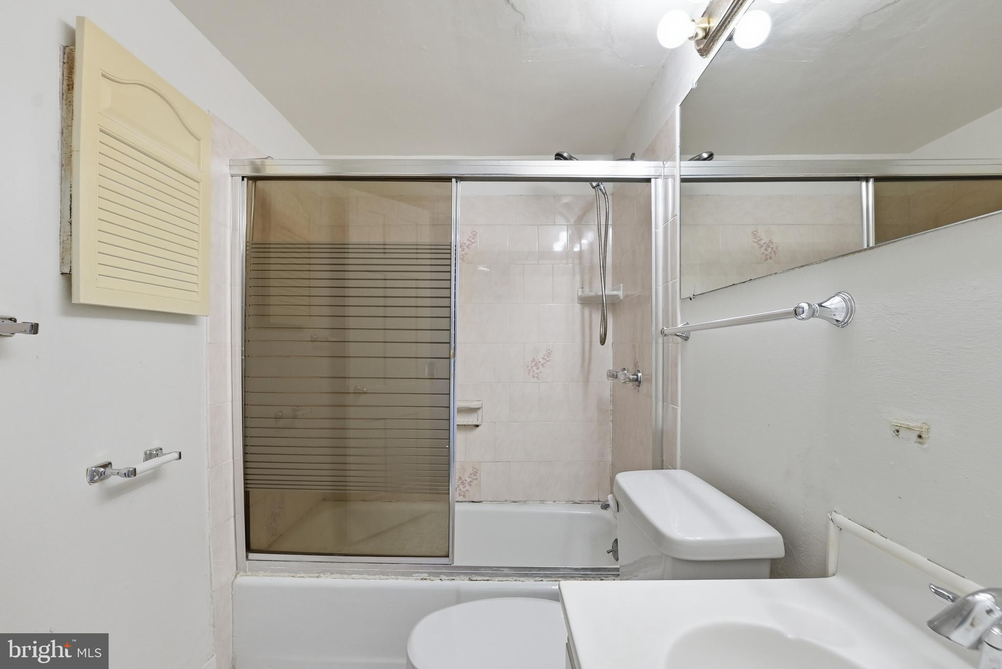 2011 37th Street Southeast, Unit 202 Washington, DC 20020 - Photo 16 of 24 a bathroom with a shower and a toilet