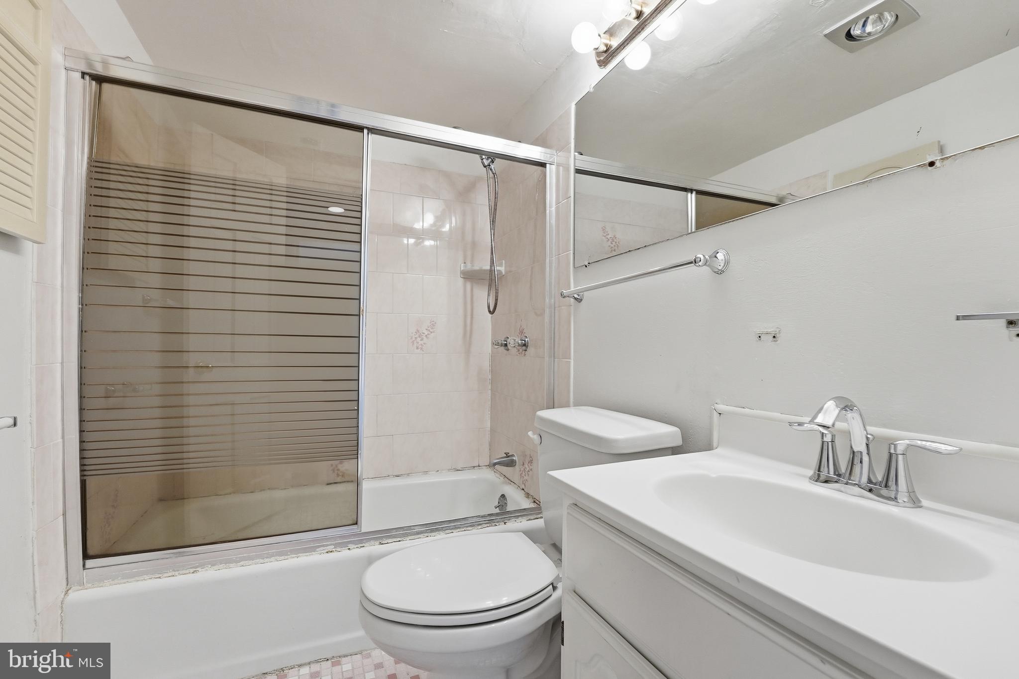 2011 37th Street Southeast, Unit 202 Washington, DC 20020 - Photo 18 of 24 a bathroom with a sink toilet and shower