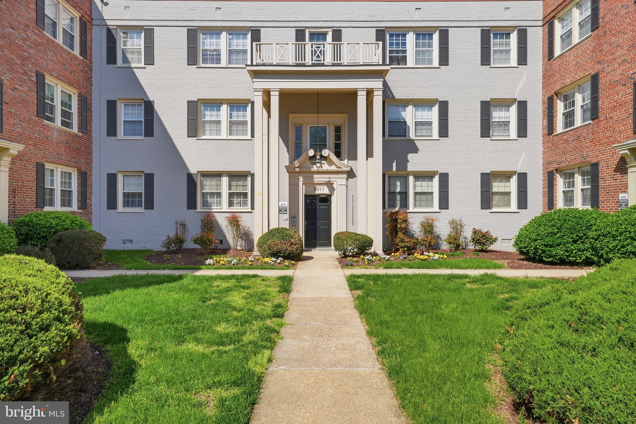 2011 37th Street Southeast, Unit 202 Washington, DC 20020 - Photo 23 of 24 a front view of a house with yard and green space