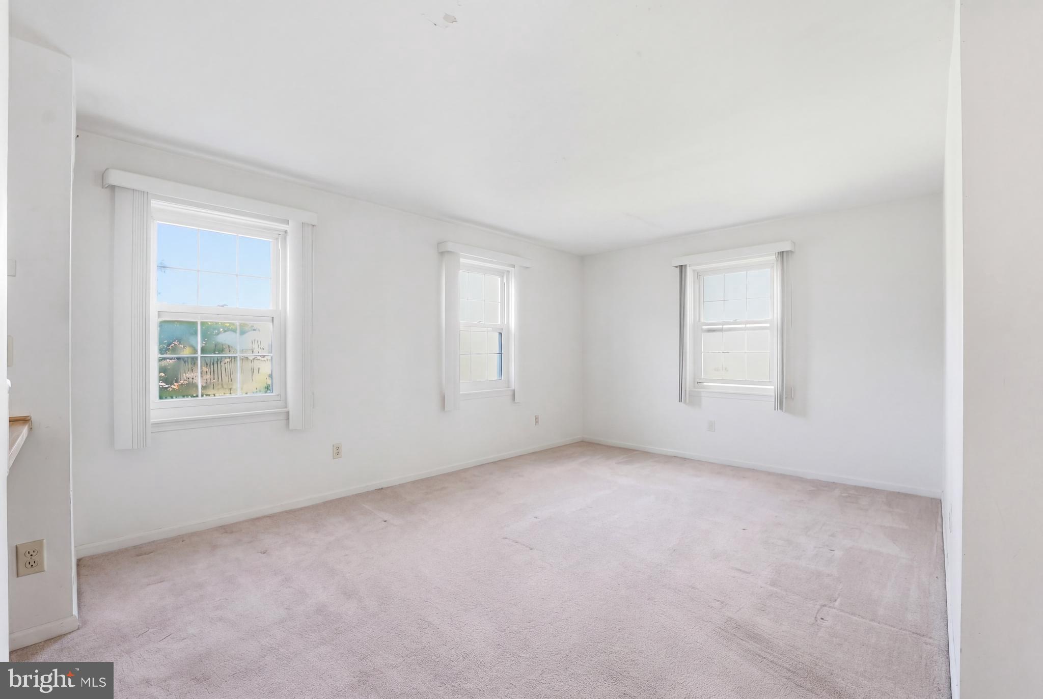 2011 37th Street Southeast, Unit 202 Washington, DC 20020 - Photo 9 of 24 an empty room with windows