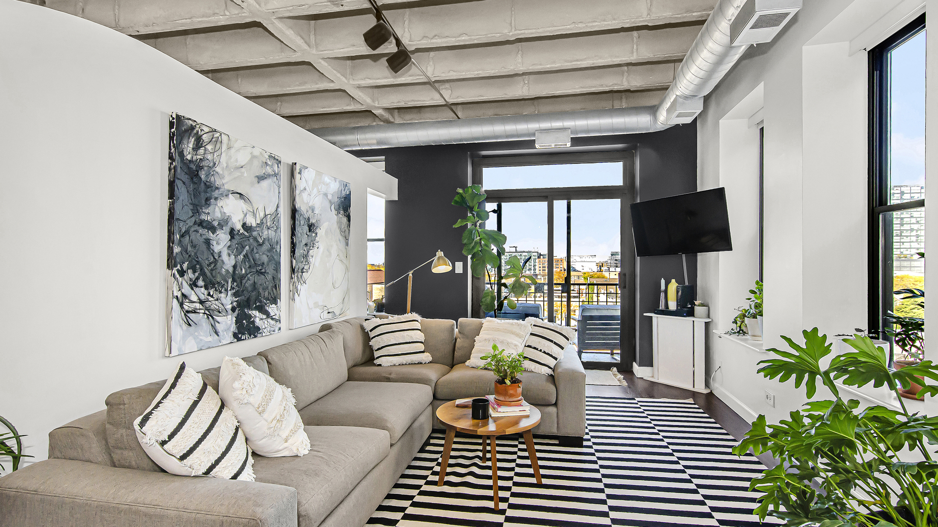 811 South Lytle Street, Unit 508 Chicago, IL 60607 - Photo 3 of 36 a living room with furniture and a flat screen tv
