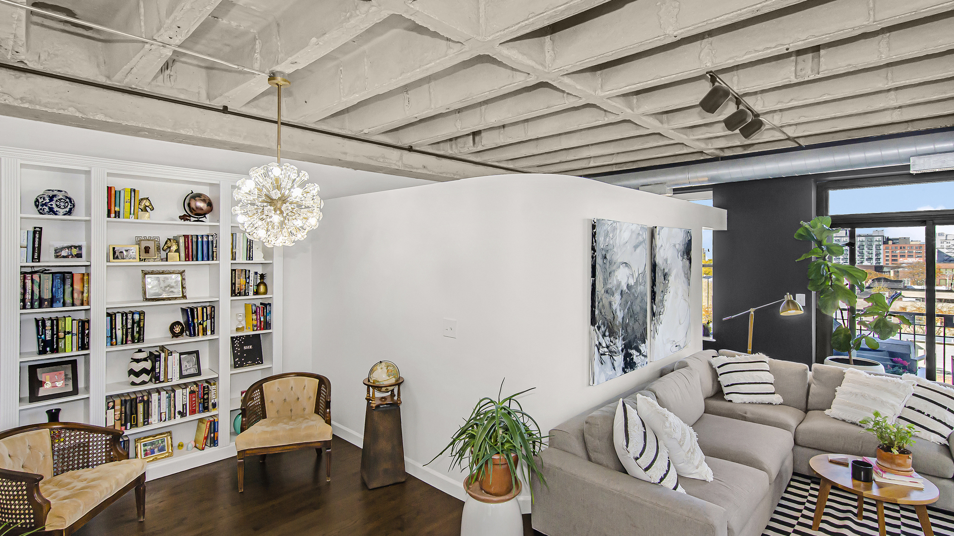 811 South Lytle Street, Unit 508 Chicago, IL 60607 - Photo 5 of 36 a living room with furniture and a book shelf