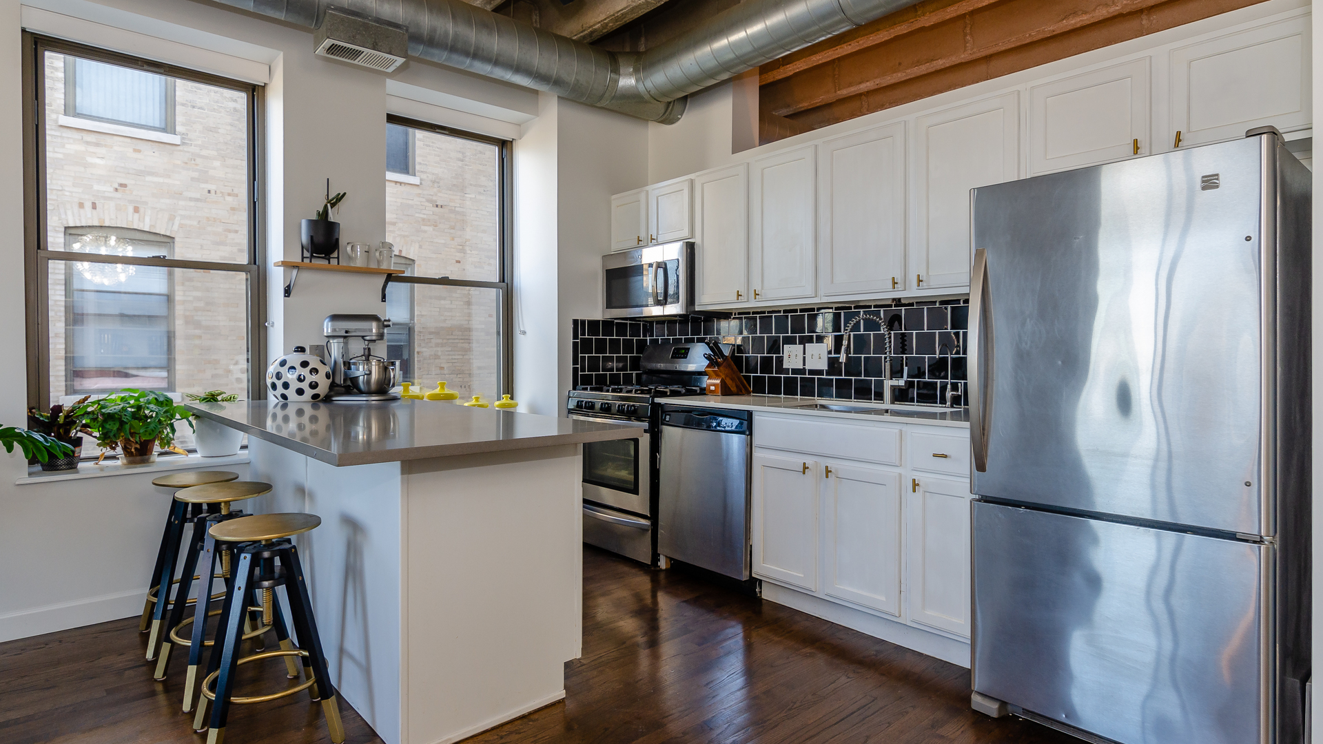 811 South Lytle Street, Unit 508 Chicago, IL 60607 - Photo 9 of 36 a kitchen with stainless steel appliances a refrigerator sink and cabinets
