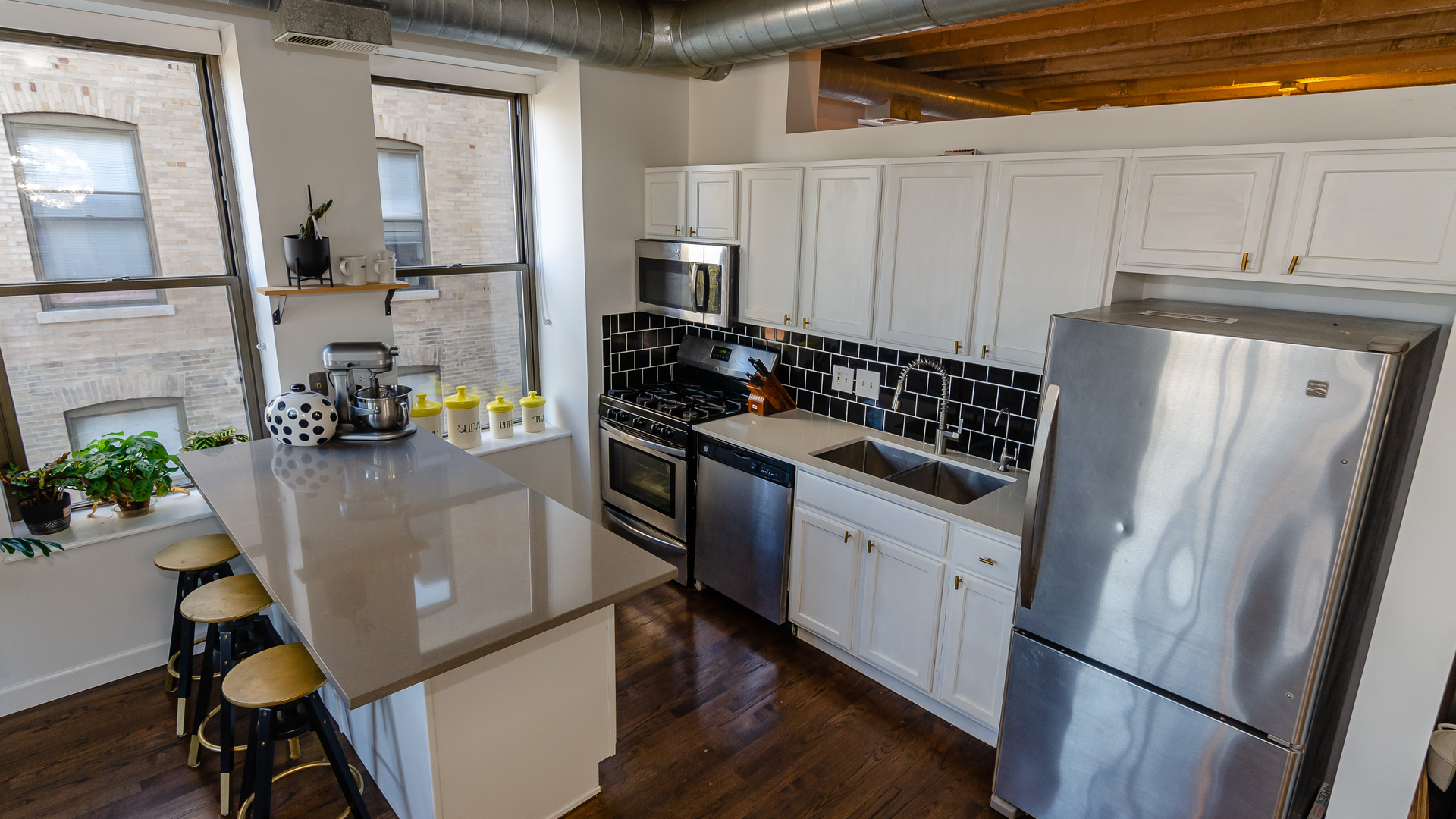 811 South Lytle Street, Unit 508 Chicago, IL 60607 - Photo 10 of 36 a kitchen with white cabinets and refrigerator