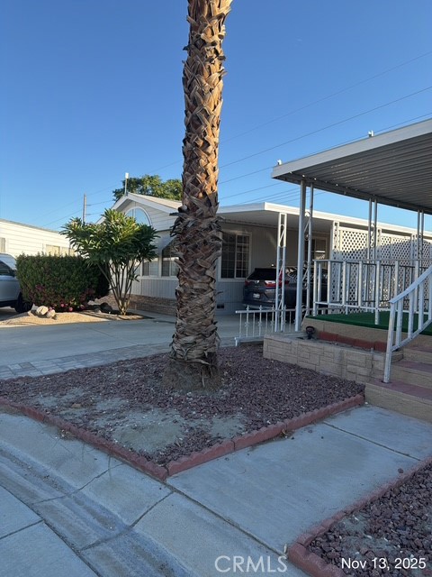 46618 Madison Street, Unit 33 Indio, CA 92201 - Photo 2 of 10 a view of outdoor space yard and porch