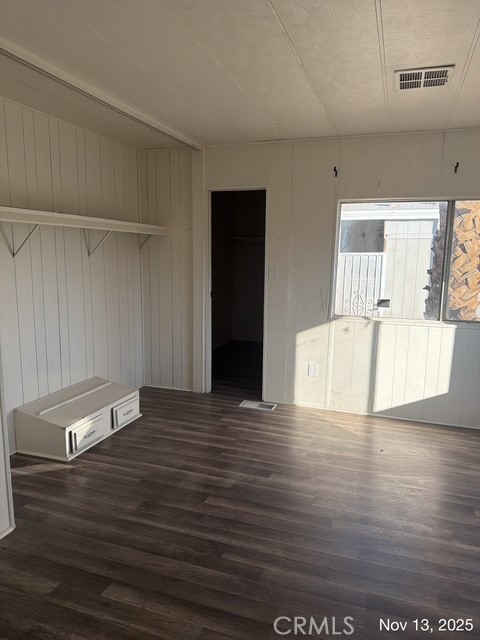 46618 Madison Street, Unit 33 Indio, CA 92201 - Photo 4 of 10 a view of empty room with wooden floor