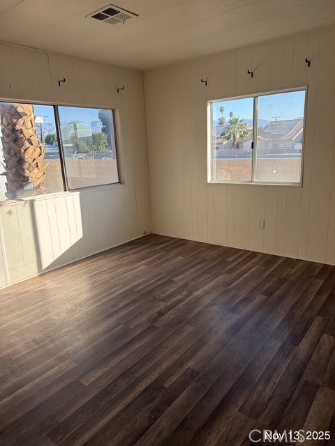 46618 Madison Street, Unit 33 Indio, CA 92201 - Photo 8 of 10 a view of an empty room with wooden floor and a window