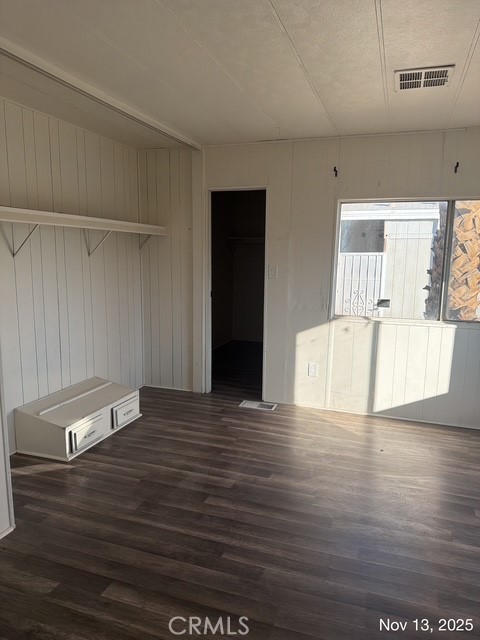 46618 Madison Street, Unit 33 Indio, CA 92201 - Photo 10 of 10 a view of empty room with wooden floor